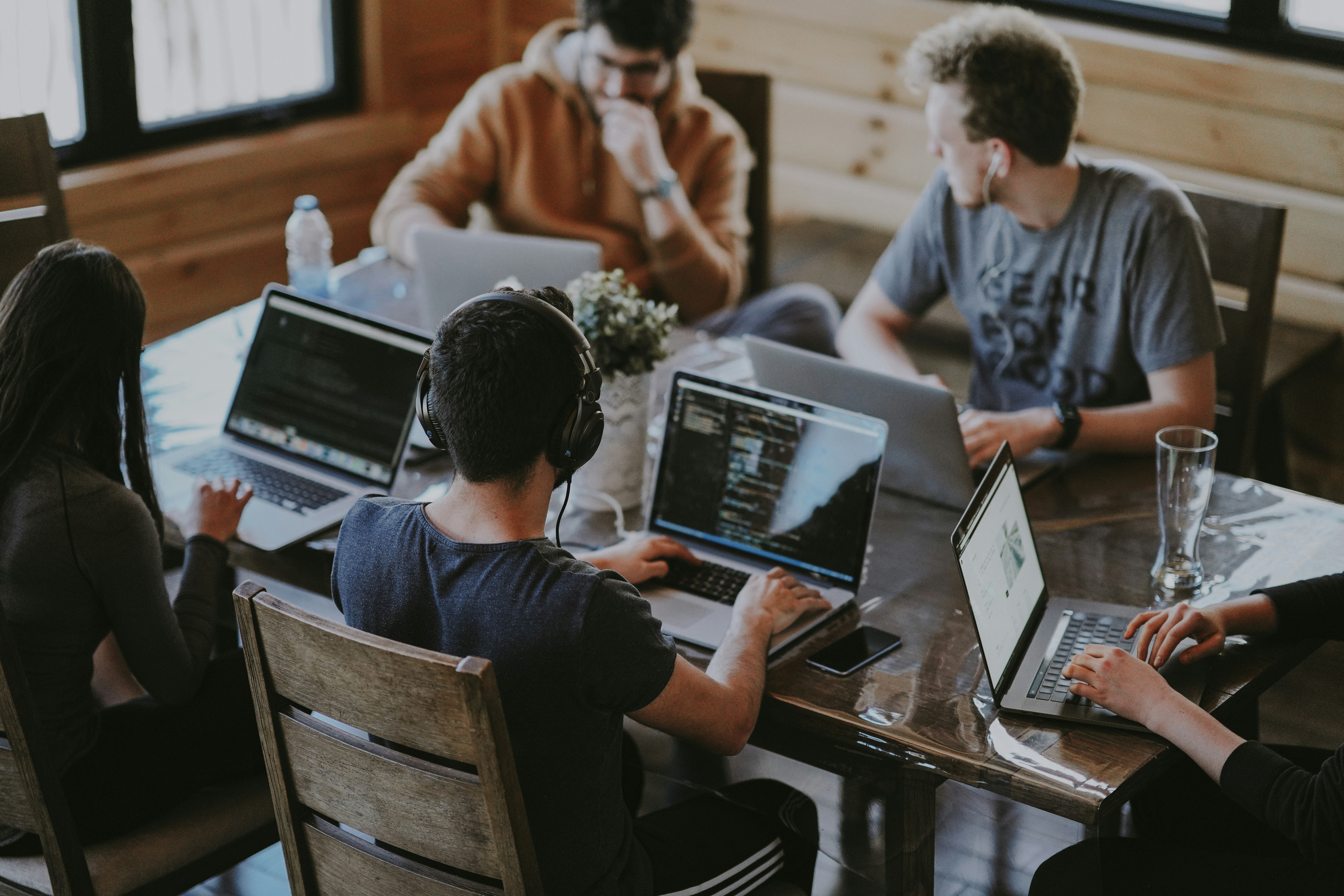 Group of creatives discussing a project around a table