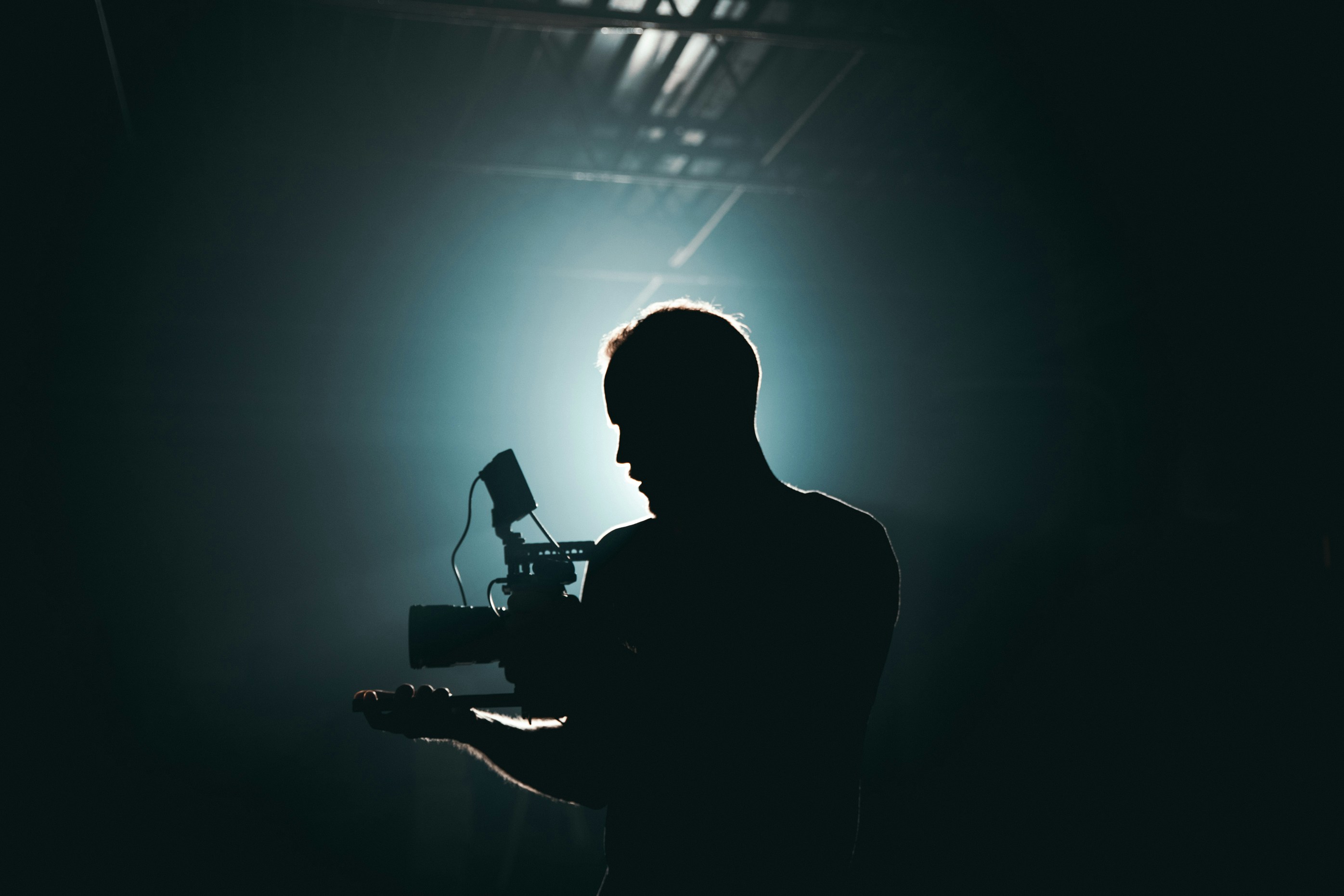 Filmmaker operating a camera on set